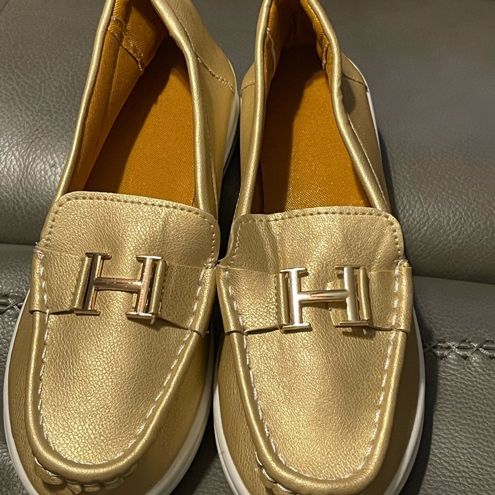 Gold loafers.  Never worn.